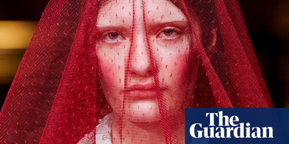 Style followers and soccer bands: photographs of the day – Friday – The Guardian