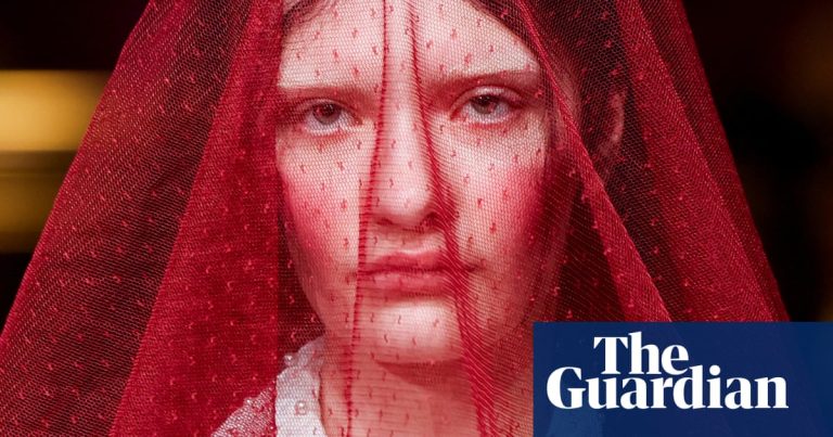 Style followers and soccer bands: photographs of the day – Friday – The Guardian