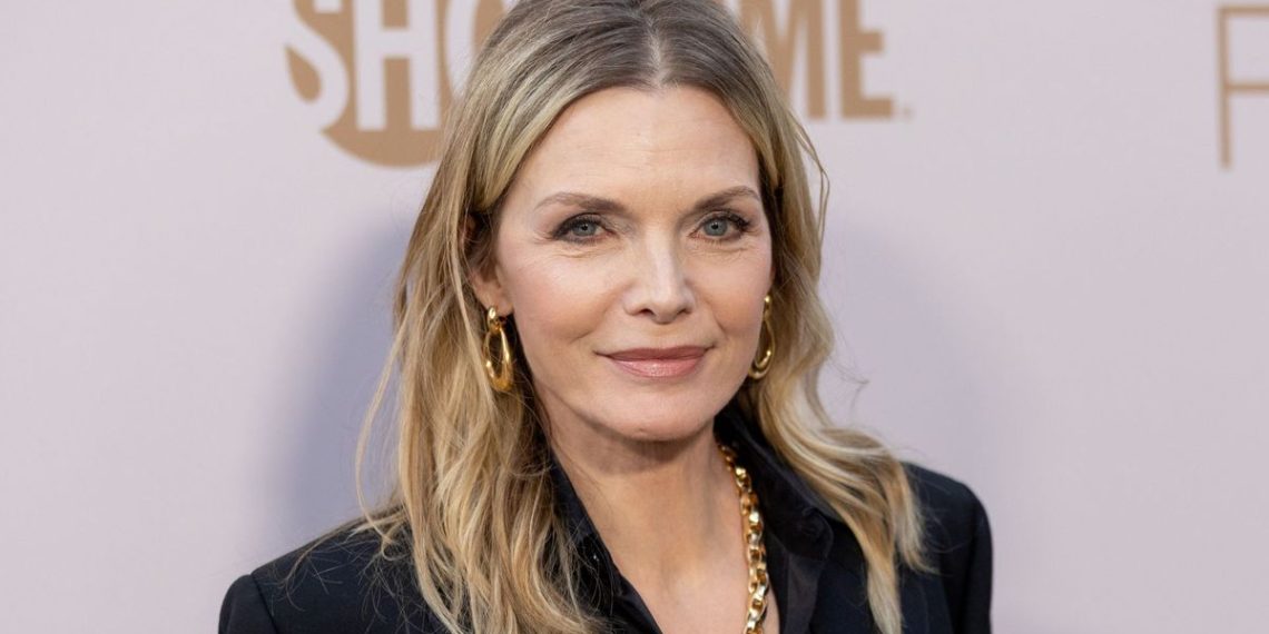 Michelle Pfeiffer⁣⁣ simply wore a Wall Avenue stylish go well with prefer it’s 1985
