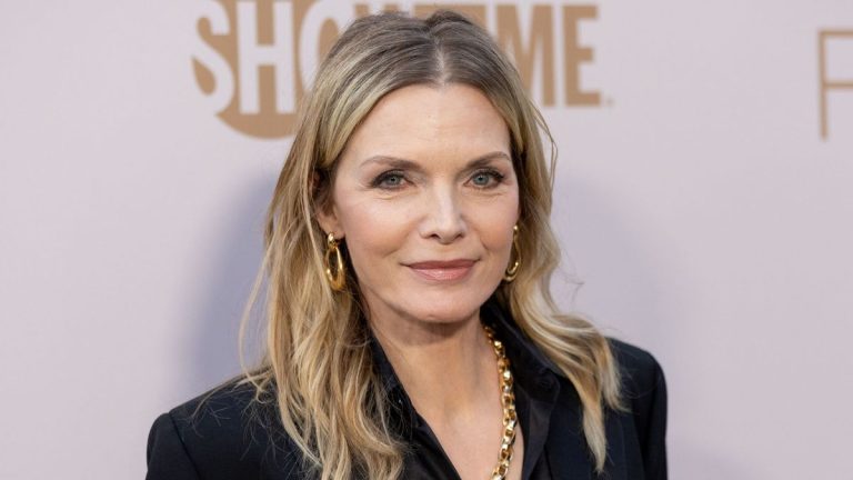 Michelle Pfeiffer⁣⁣ simply wore a Wall Avenue stylish go well with prefer it’s 1985