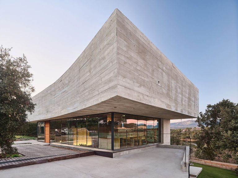 Oak Home is a concrete and glass home with floating ranges