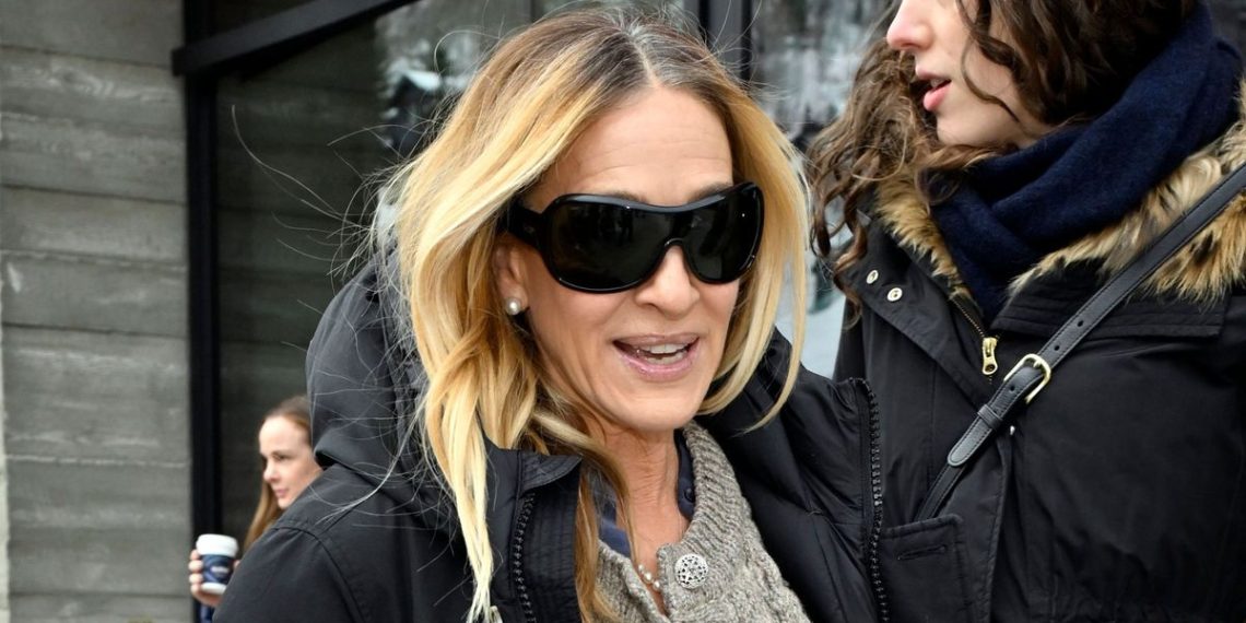 Sarah Jessica Parker’s showstopping purple knee highs take her cosy cardigan and maxi skirt mixture to a complete new degree