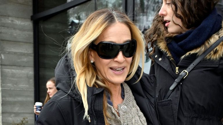 Sarah Jessica Parker’s showstopping purple knee highs take her cosy cardigan and maxi skirt mixture to a complete new degree