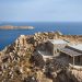 Uncovered stone masonry fuses The residence restored by Co Lab with the rocky land of the Greek island