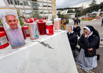 The Vatican says he has improved barely, he has no fever, he’s steady and works from the hospital