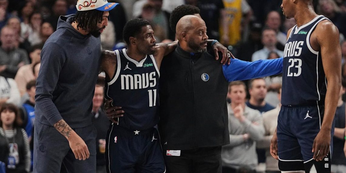 Mavericks ‘star Kyrie Irving, helped the ground after an uncomfortable knee damage at the start of the kings’ loss