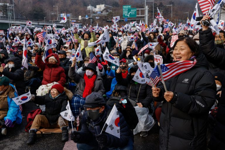 Aggressive authorities troops look exterior the South Korean presidential ban