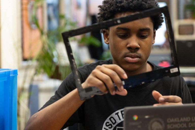 Oakland college students restore college laptops in Arms-on-Tech program