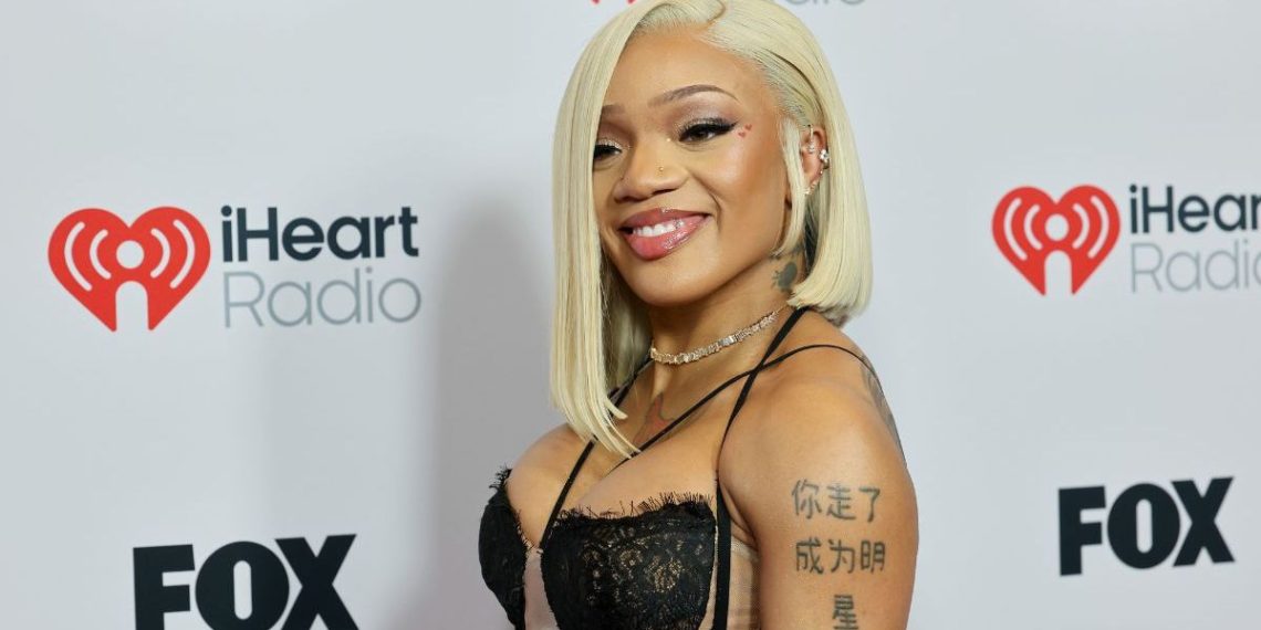 GloRilla’s Shimmery Costume in iHeartRadio Pictures Is All About Strings