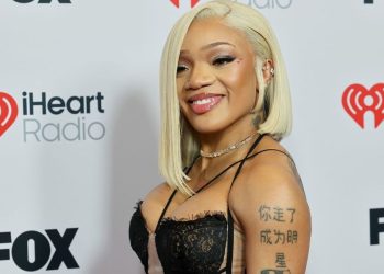 GloRilla’s Shimmery Costume in iHeartRadio Pictures Is All About Strings