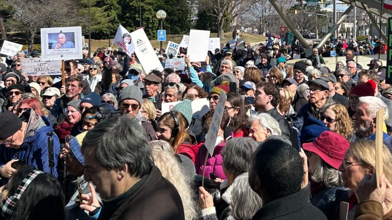 Protest exterior NIH HQ in Bethesda opposes doable cuts to healthcare