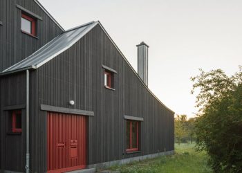 Darkish wooden facade of KO/OK contrasts current bead home