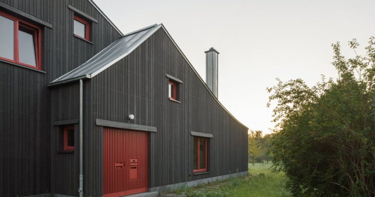 Darkish wooden facade of KO/OK contrasts current bead home