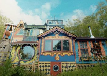 Within the “Electrical Backyard”, Ricky Bosscarino runs a tour of his capricious – Colossal Hand home