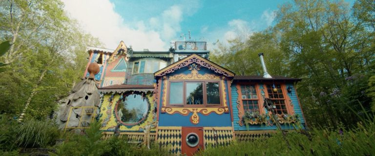Within the “Electrical Backyard”, Ricky Bosscarino runs a tour of his capricious – Colossal Hand home