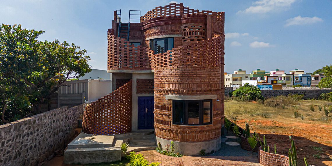 The home of company of brick flowing from artwork and spiral structure as a cactus below the Indian Solar