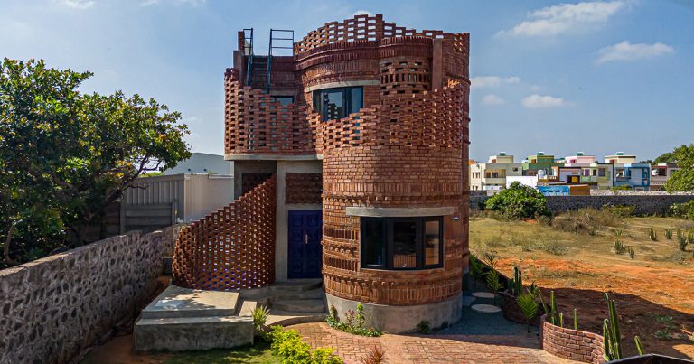 The home of company of brick flowing from artwork and spiral structure as a cactus below the Indian Solar