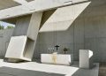 Fragmented concrete volumes type lights within the Church of Meixner Schlüter Wendt