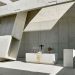 Fragmented concrete volumes type lights within the Church of Meixner Schlüter Wendt