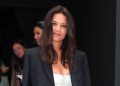 Katie Holmes’ option to put on a white midi gown remains to be the most effective