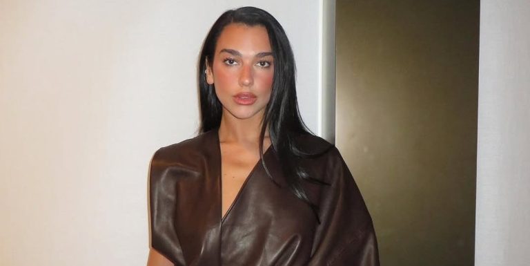 Dua Lipa wore a chocolate asymmetrical costume for pop-up occasion