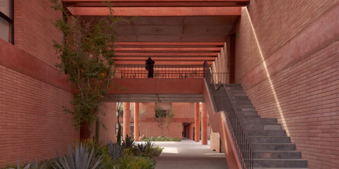 Volumes and gaps made from pink brick weave Sordo Madaleno’s soccer campus in Mexico