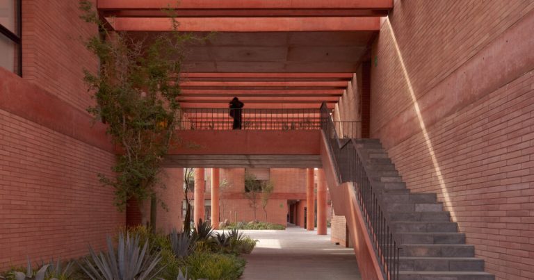 Volumes and gaps made from pink brick weave Sordo Madaleno’s soccer campus in Mexico
