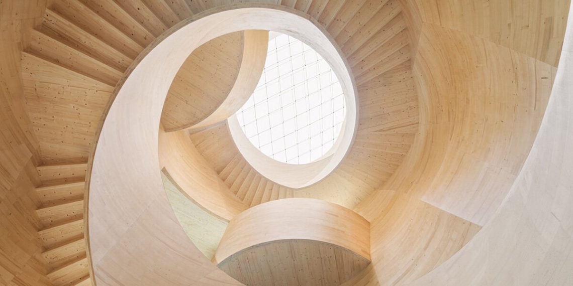 Spiraling timber atrium de icd connects the flooring to Blmer Lehmann HQ in Switzerland