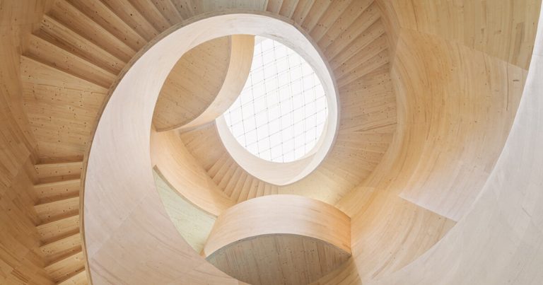 Spiraling timber atrium de icd connects the flooring to Blmer Lehmann HQ in Switzerland