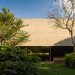 The monolithic concrete home of the MK27 studio is held on the tropical backyard of São Paulo