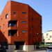 The crimson brick facade wraps the Cornerstone of LKSA housing unit in Korea