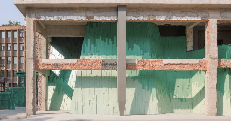 The Wutopia Inexperienced Stratified Facade, harking back to Chinese language portray, transforms the manufacturing facility into theater