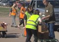 Chamberlain college students hand out meals at Sioux Falls giveaway