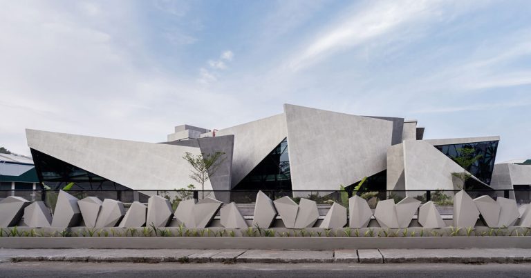 The angular concrete partitions define the facade of the workspace much like the crystal by curved measurement