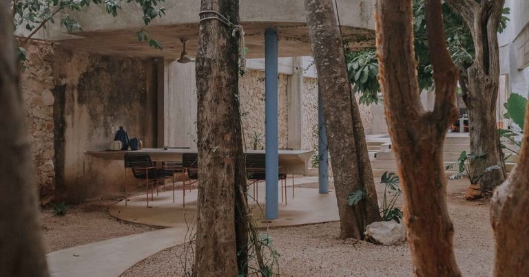 The Mexican home of Ludwig Godefroy runs like a porous concrete peel across the lush courts