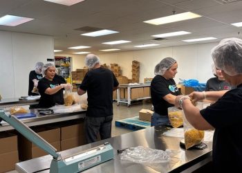 2 Information joins Utah Meals Financial institution to package deal meals for households in want throughout annual service day