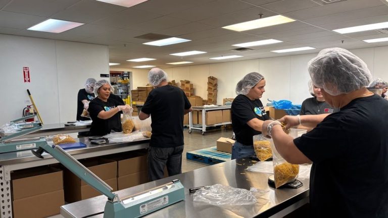 2 Information joins Utah Meals Financial institution to package deal meals for households in want throughout annual service day