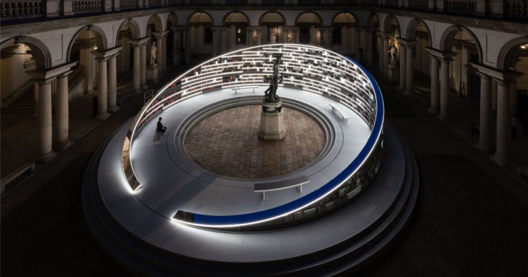 Set up of Es Devlin’s rotary library illuminates the Milan Design Week