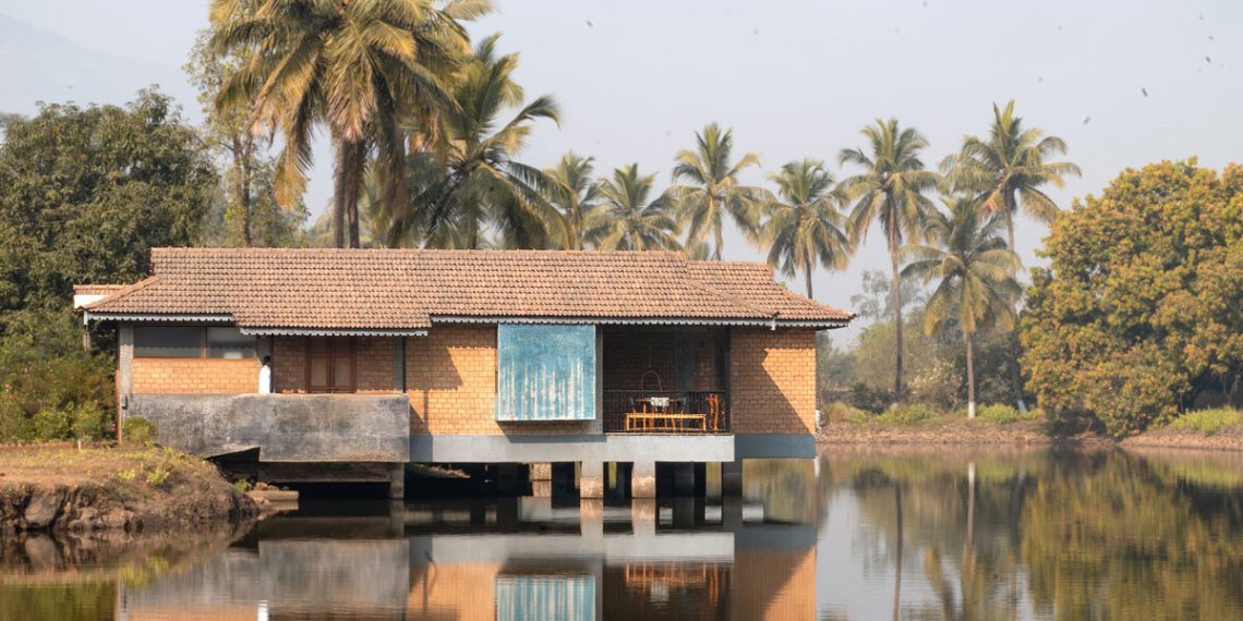 The homes within the pond designed from the land blocks float above the earth and water in India