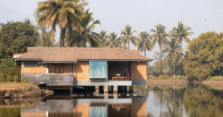 The homes within the pond designed from the land blocks float above the earth and water in India