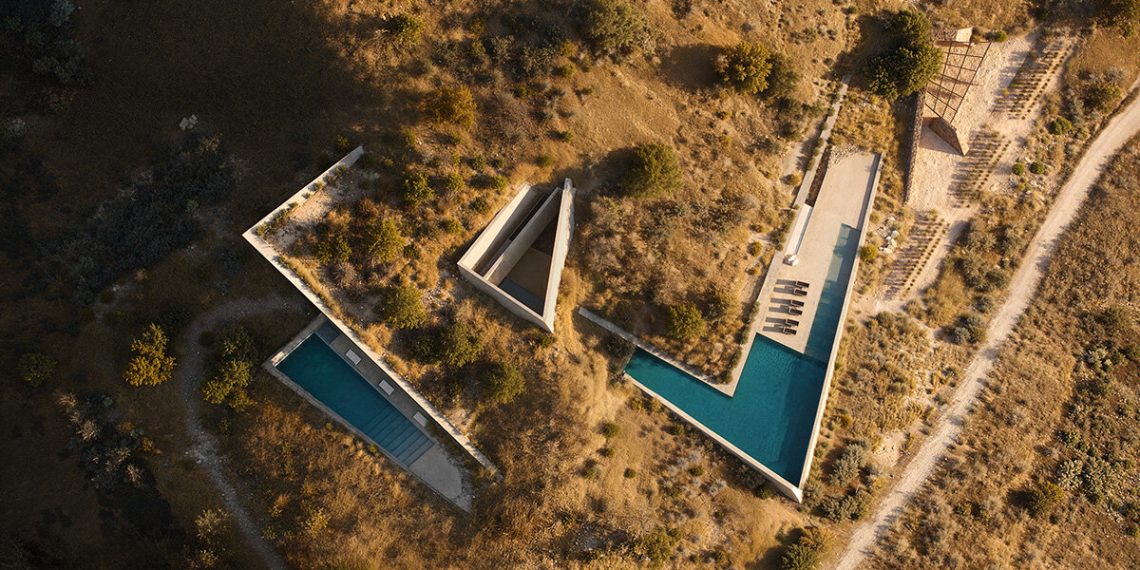 The triangular inclined roofs of the Dallas architect’s residence rises from Earth to Greece