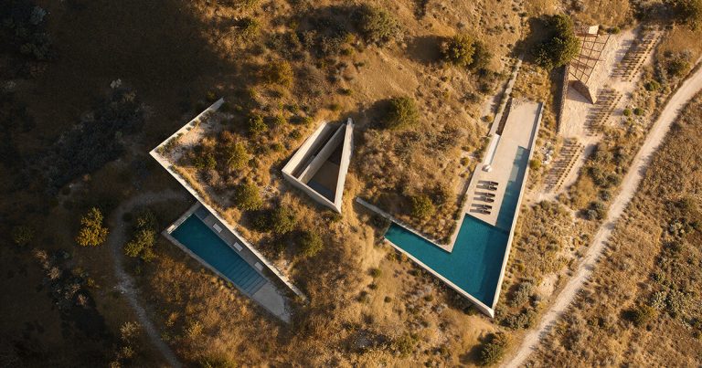 The triangular inclined roofs of the Dallas architect’s residence rises from Earth to Greece