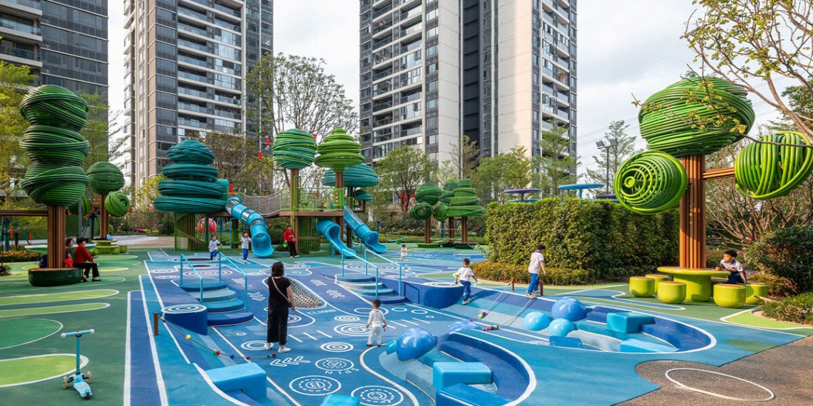 Multicolored curved buildings form the 100harchitects forest play panorama