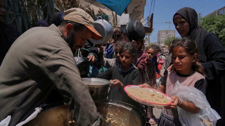Palestinians block and empty dozens of UN meals lorries in Gaza Strip