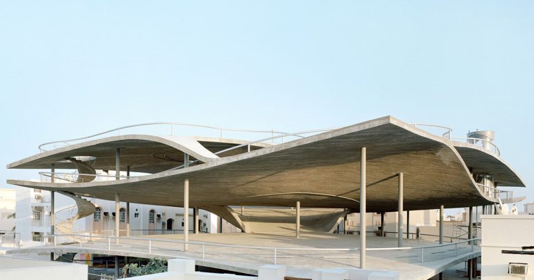 Christian Kerez eliminates ramps from Bahrain parking heaps with inclined concrete geometries