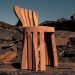 ROC H BIEL turns beech mud on a chair impressed by Corinthian columns
