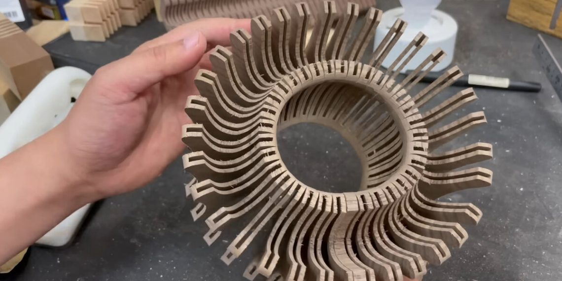 Kurahito craft creates versatile picket lamp lid in timber