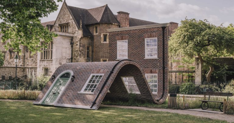 Alex Chinneck’s brick facade sculpture sits in London