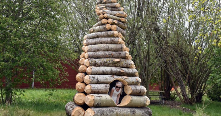 Twist Timber by ULF Mejergren reimagates the cabinets shelter as a spiral log cabin