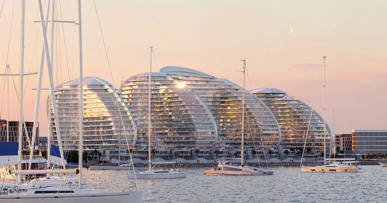 Zaha Hadid Architects carve the towers on the seafront for Marjan Island within the United Arab Emirates